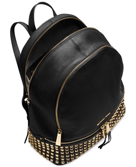 michael kors backpack black gold zipper|Michael Kors black leopard backpack.